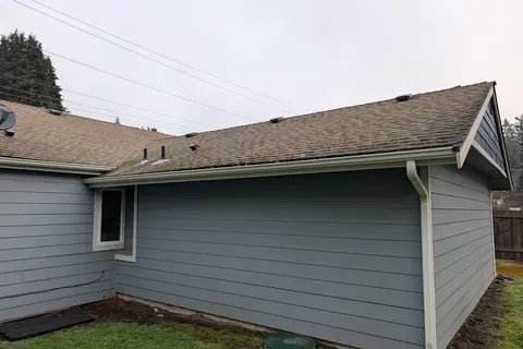 A home in Orting before its roof, siding and gutter work
