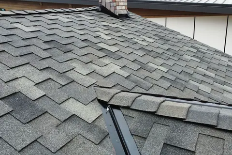 Malarkey Windsor shingle courses meeting the ridge on a Lake Tapps home