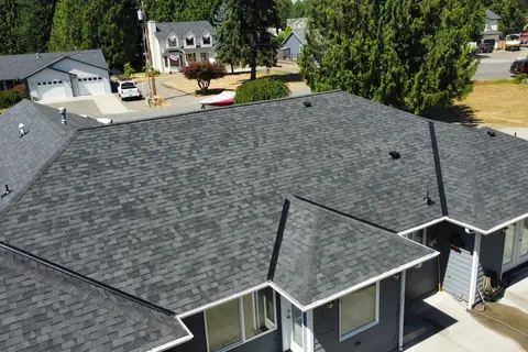 A completed Malarkey Vista roof at Driftwood Point with neighbouring homes in frame